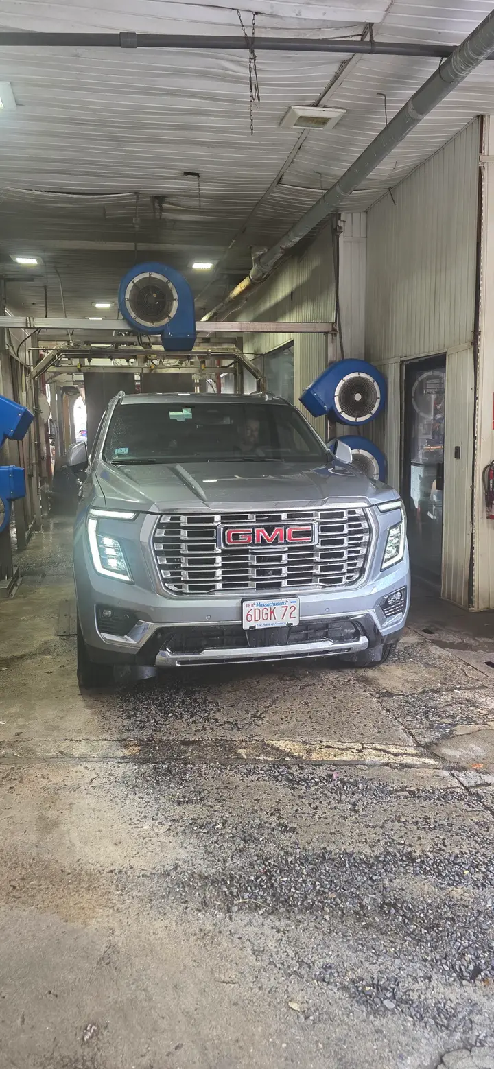SUV coming through the wash tunnel